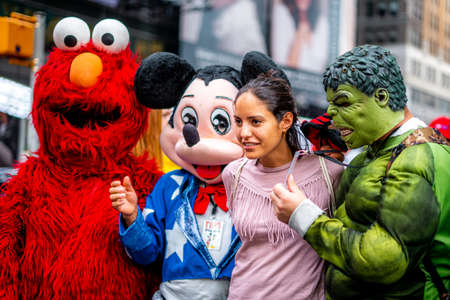 Woman and the mascots at Time sqaure in the evening , Manhattan , New york city , United States of Americaのeditorial素材