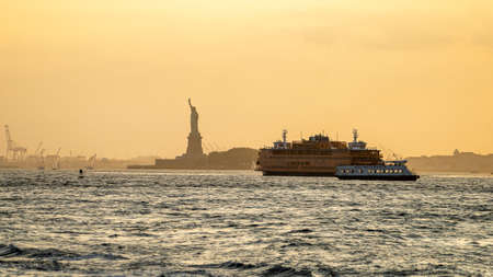 View of Statue liberty during sunset from Brooklyn riverside , Manhattan , New york city , United States of America - September 3 , 2018のeditorial素材