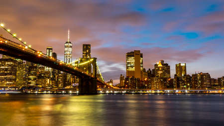 View of Manhattan skyline and Brookyn bridge from Brooklyn side after sunset , New york city , United States of America - September 3 , 2018のeditorial素材