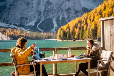 Picnic with nice view from Lago di braies . One of the most beautiful scenic lake in Dolomites late morning during Autumn seasonのeditorial素材