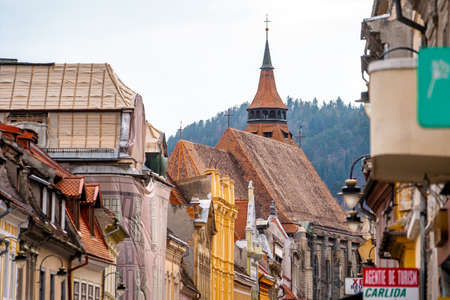 Brasov Republicii street and Council square in the evening during spring season. The most important...