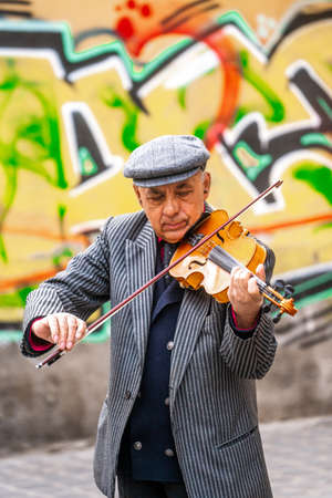 The musician perform in Republicii street near Council square in the evening during spring season . The most important street and square in the heart of Brasovのeditorial素材