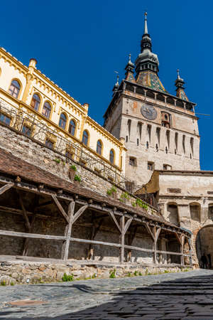 The clock tower in old town of Sighisoara  afternoon during spring season . One of the most important tower . Also SighiÈoaraのeditorial素材