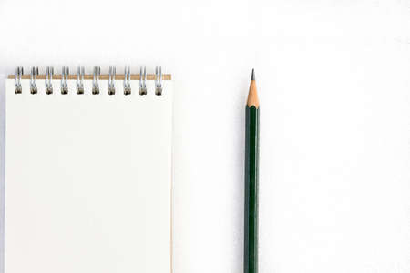 Notepad and pencil isolated on white background.の写真素材