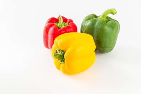 Red, yellow and green sweet peppers.