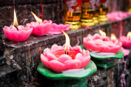 Chinese people worship with incenses, candles and oil lamps.の写真素材