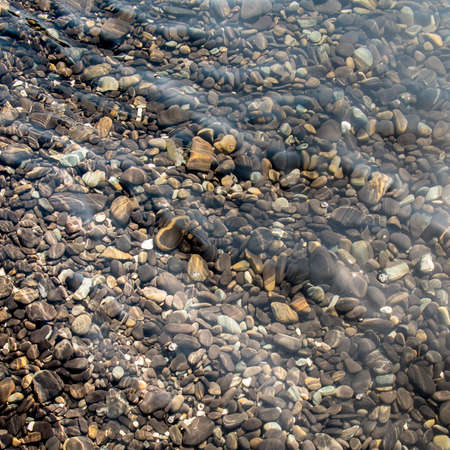 Natural stone under seawater for background.