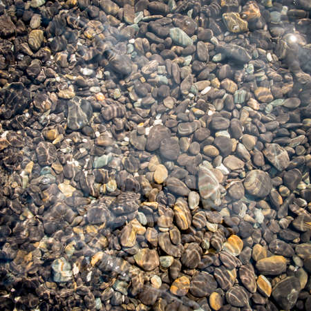 Natural stone under seawater for background.