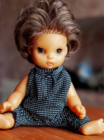 plastic children fashion doll in clothes from famous designers close-upの写真素材