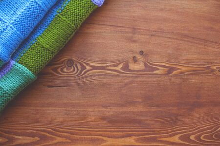 beautiful waxed wooden background with scarf side view. flat lay top view close-up