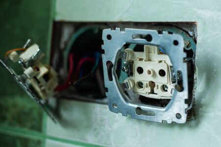 replacement of wall outlet , installation of sockets in socket boxes,electrician connects...