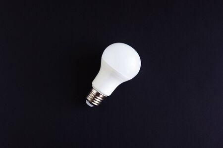 white LED Eco lamp on a black background close-up