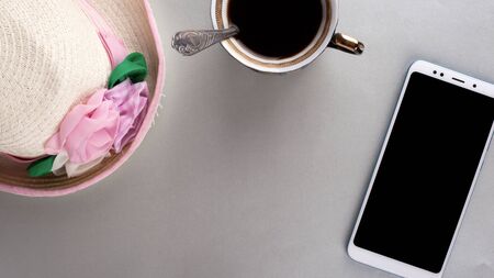 coffee phone and women's hat flat lay copy space,fashion minimalist  top view close-upの写真素材
