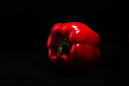 Red sweet peppers (paprika) on a dark background closeupの写真素材