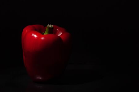 Red  sweet (Paprika) peppers on black background closeup.の写真素材