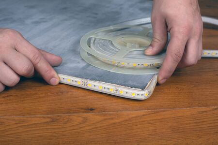 installation  led strip. installation of decorative diode lighting.
の写真素材