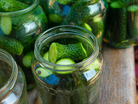 cucumbers in a jar, canning pickled gherkins.
