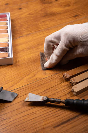restoration of laminate with wax pencils and a soldering iron