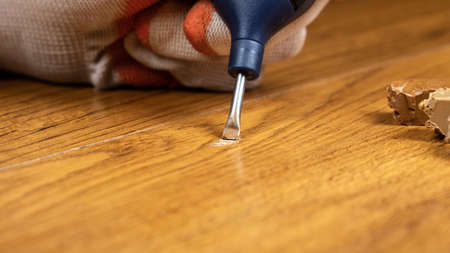 restoration and repair of laminate and parquet with wax.