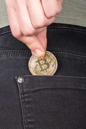 accumulation of bitcoins, investment in btc cryptocurrency,gold coin in pocket