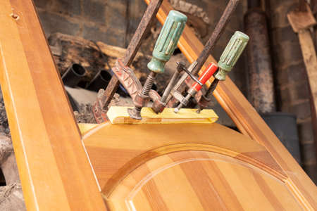 restoration wood repair, gluing doors clamped with clampsの写真素材