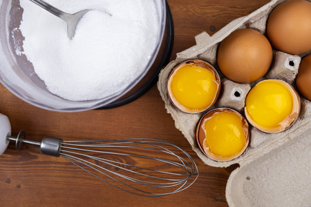 eggs and grinded sugar meringue cooking processの写真素材