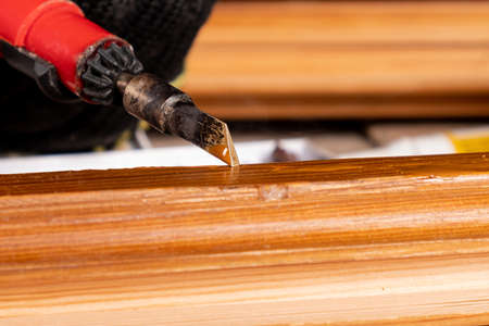 restoration and elimination of defects on a wooden surface using hot wax