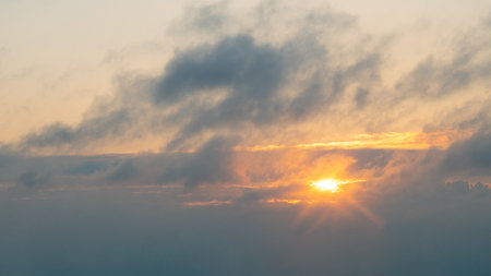 beautiful orange evening sunset sky with cloud, the sun goes down.の写真素材