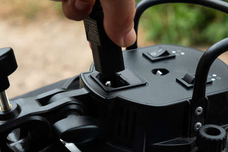 insert the power cable into the electrical equipmentの写真素材