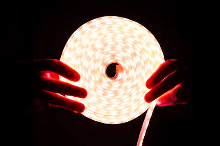 LED Strip Light, red coil diode lighting in hand