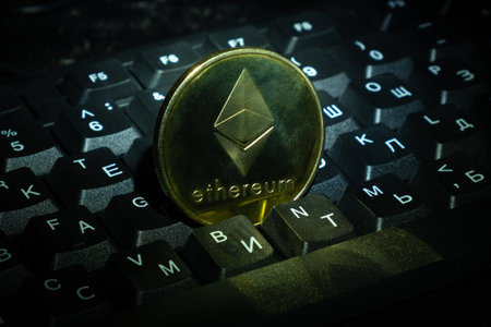 gold coin Ethereum (ETH) on keyboard close-up cryptocurrency shopping and making money onlineの写真素材