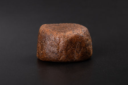 cannabis trichomes, a piece of hashish on a dark backgroundの写真素材