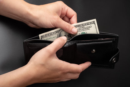 100 dollar bill in wallet, money exchange rate concept