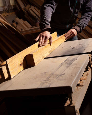 carpenter milling a wooden board,woodworking machine