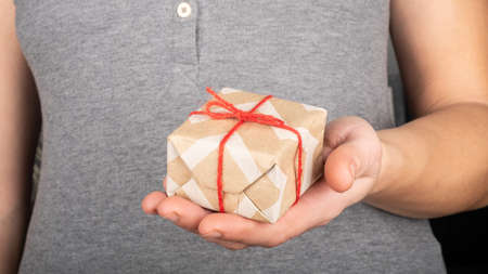 present for Valentines Day gift box in hand, give a gift in New Year