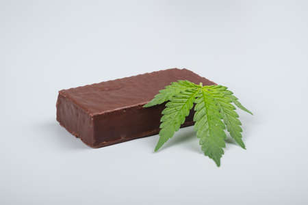 chocolate candy and cannabis leaf, thc sweets drugsの写真素材