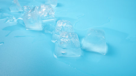 ice cubes closeup on blue background.の写真素材