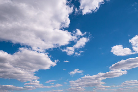 floating white clouds in the blue sky.