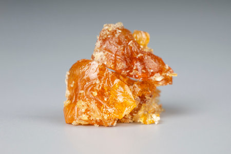 a piece of cannabis wax clsoeup. concentrate dab stone with high thc.の写真素材