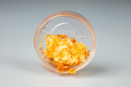orange golden extract cannabis dab in a bottle, wax with high thc.の写真素材