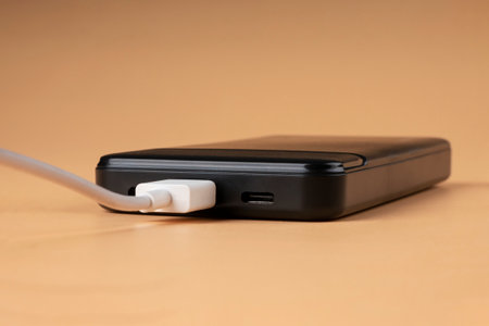 black phone charging from usb closeup.の写真素材