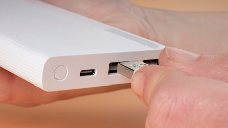 usb phone to power bank, portable accumulator for charging connecting smartphone.の写真素材