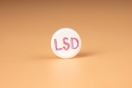 lsd pill closeup on beige background, psy tablet for trip.の写真素材