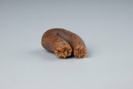 hashish rope for smoke cannabis blunt, high thc weed brown hash on gray background.