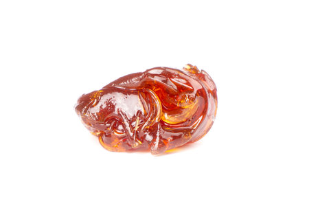 piece fragrant amber terp sauce for smoking cannabis, isolated wax weed with thc content.の写真素材