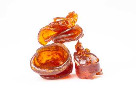 fragrant wax stone shatter for smoking cannabis isolated on white background, rosin weed with thc.の写真素材