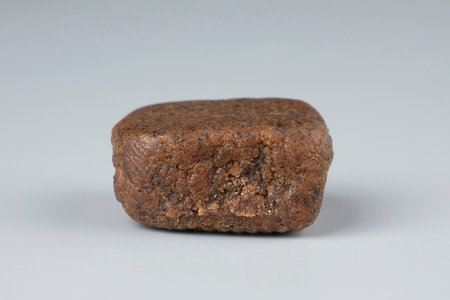 cannabis brown hashish closeup on gray background, moroccan hashish.の写真素材