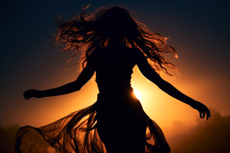 Silhouette of a young woman with flowing hair against a captivating night sky, evoking a sense of freedom and mystery generative ai.の素材