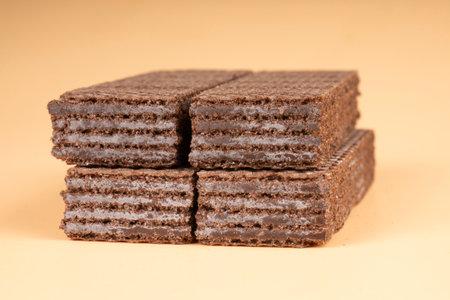 sweet sliced waffles on beige background