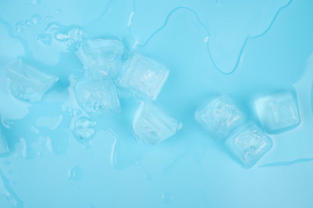 transparent clean ice cubes on a blue backgroundの写真素材